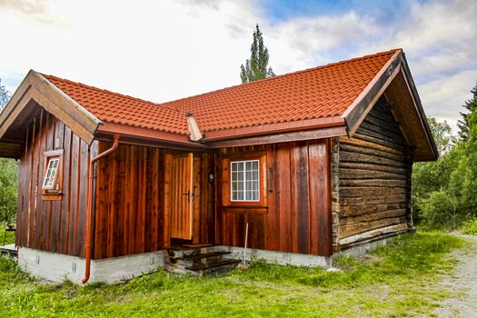 Brown red wooden cabin hut in Hemsedal, Norway.