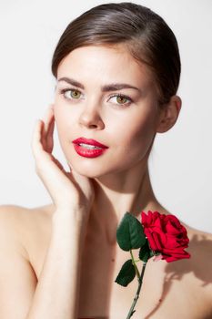 Woman with bare shoulders Holds a hand near Faces red lips cropped view