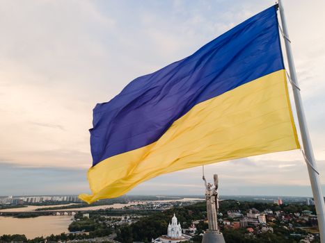 Kyiv - National flag of Ukraine by day. Aerial. Kiev