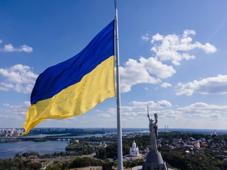 Kyiv - National flag of Ukraine by day. Aerial. Kiev