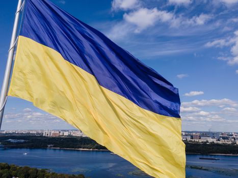 Kyiv - National flag of Ukraine by day. Aerial. Kiev