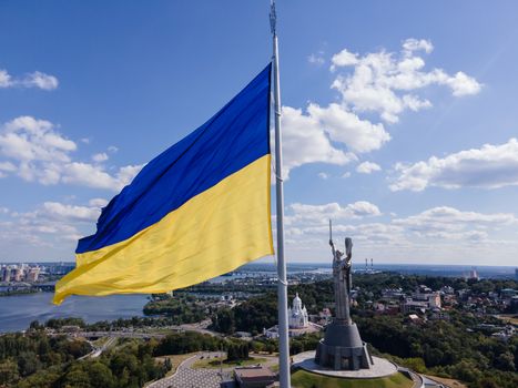 Kyiv - National flag of Ukraine by day. Aerial. Kiev