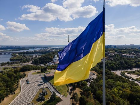 Kyiv - National flag of Ukraine by day. Aerial. Kiev