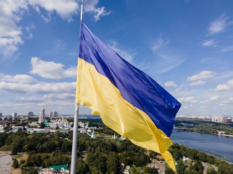 Kyiv - National flag of Ukraine by day. Aerial. Kiev