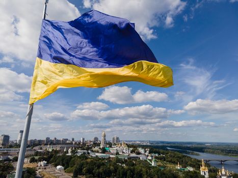 Kyiv - National flag of Ukraine by day. Aerial. Kiev