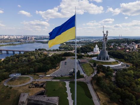 Kyiv - National flag of Ukraine by day. Aerial. Kiev