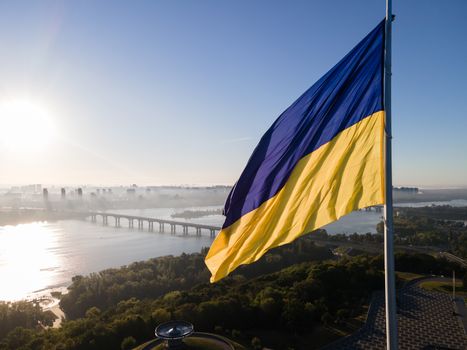 Kyiv - National flag of Ukraine by day. Aerial. Kiev