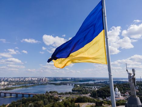 Kyiv - National flag of Ukraine by day. Aerial. Kiev