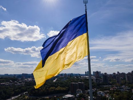 Kyiv - National flag of Ukraine by day. Aerial. Kiev