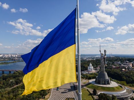 Kyiv - National flag of Ukraine by day. Aerial. Kiev