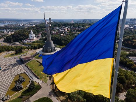 Kyiv - National flag of Ukraine by day. Aerial. Kiev