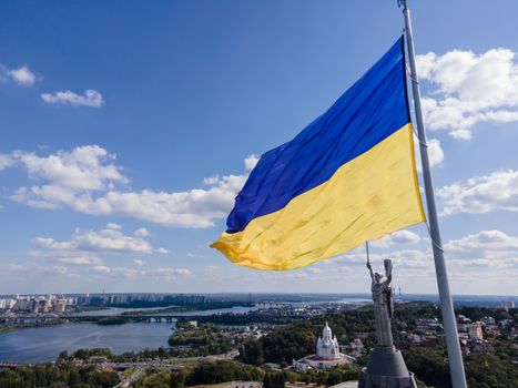 Kyiv - National flag of Ukraine by day. Aerial. Kiev