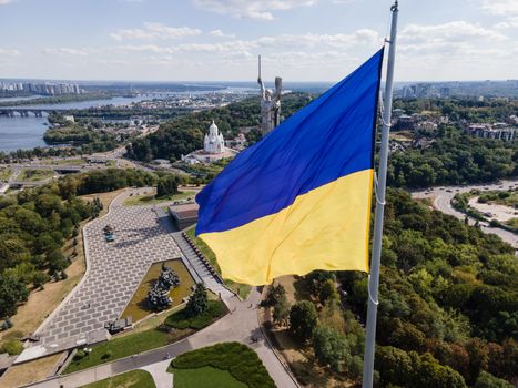 Kyiv - National flag of Ukraine by day. Aerial. Kiev