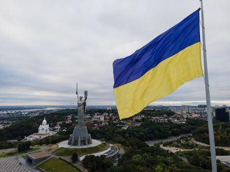 Kyiv - National flag of Ukraine by day. Aerial. Kiev