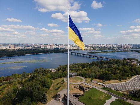 Kyiv - National flag of Ukraine by day. Aerial. Kiev