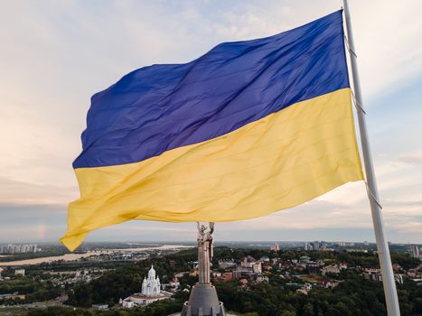 Kyiv - National flag of Ukraine by day. Aerial. Kiev