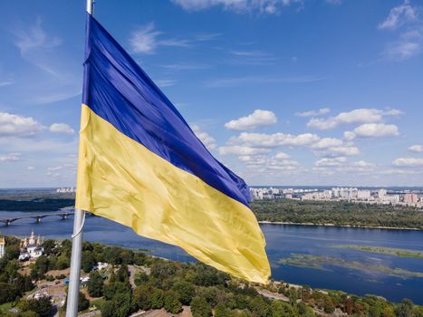 Kyiv - National flag of Ukraine by day. Aerial. Kiev