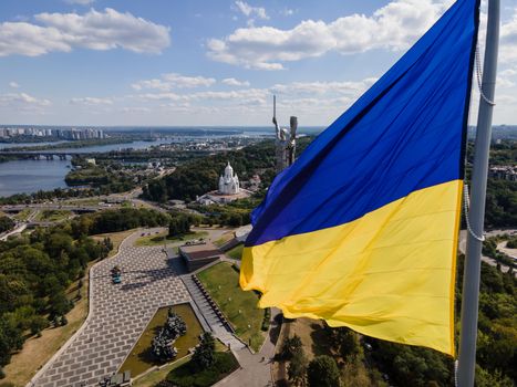 Kyiv - National flag of Ukraine by day. Aerial. Kiev