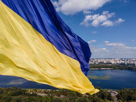 Kyiv - National flag of Ukraine by day. Aerial. Kiev