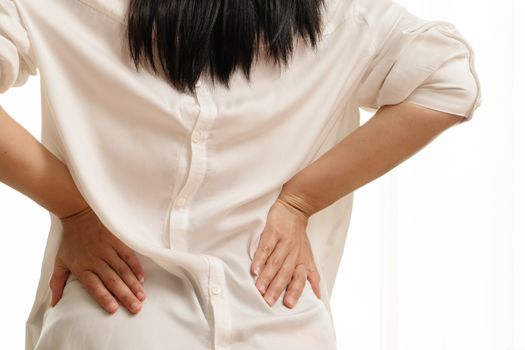 back pain at home. women suffer from backache. healthcare and medical concept
