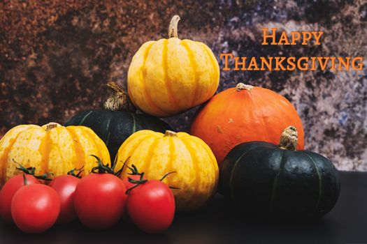 Happy Thanksgiving Day with pumpkin and tomato