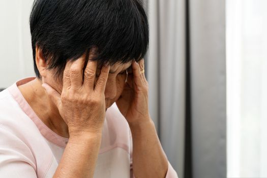 old woman suffering from headache, stress, migraine, health problem concept
