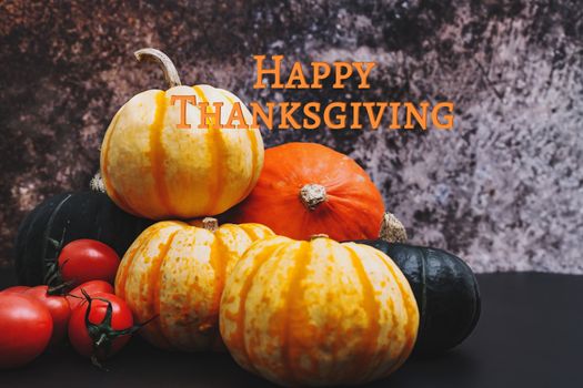 Happy Thanksgiving Day with pumpkin and tomato