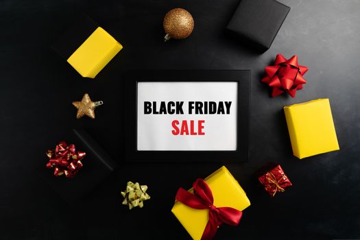 gift box with photo frame for Black Friday Sale concept on black background