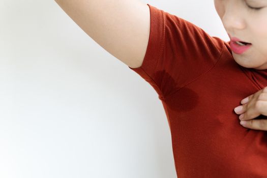 woman with hyperhidrosis sweating. Young Asia woman with sweat stain on her underarm clothes. Healthcare concept