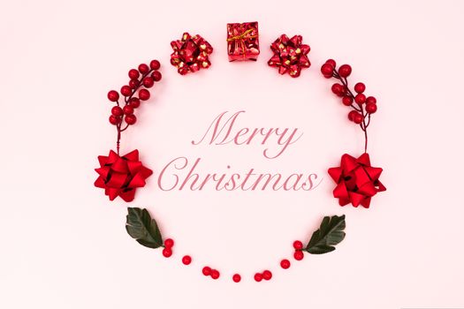 Christmas wreath on pink background. Christmas decoration. Flat lay, top view, copy space