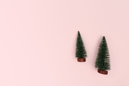 Christmas tree on pink background. Christmas, winter, new year concept. Flat lay, top view