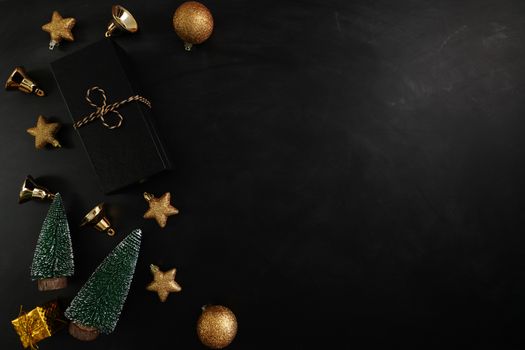 Christmas present with xmas decoration on black background