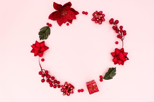 Christmas wreath on pink background. Christmas decoration. Flat lay, top view, copy space