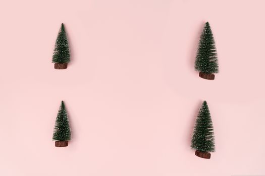 Christmas tree on pink background. Christmas, winter, new year concept. Flat lay, top view