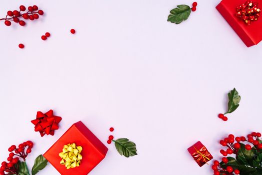 Christmas decoration. red gift box on purple background. Christmas, winter, new year concept. Flat lay, top view, copy space