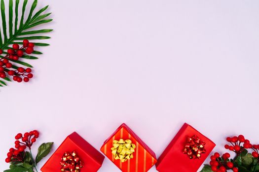 Christmas decoration. red gift box on purple background. Christmas, winter, new year concept. Flat lay, top view, copy space