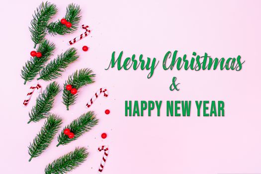 Christmas pine tree with xmas decoration on pink background