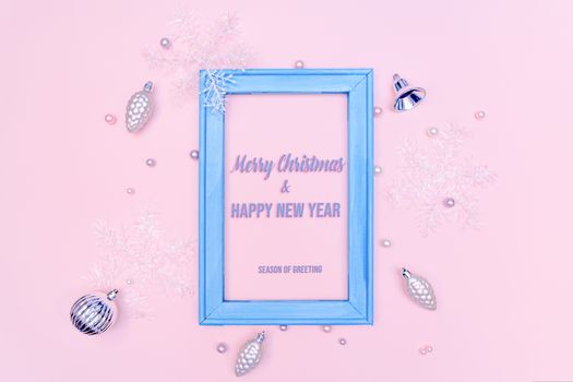 Christmas gold ball and snowflake with photo frame on pink background