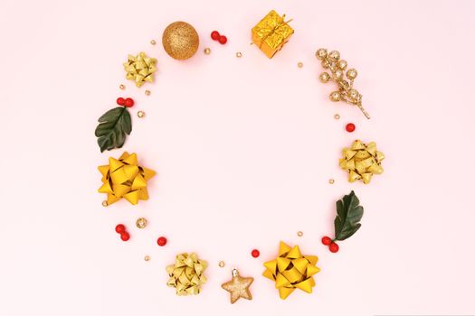 Christmas wreath on pink background. Christmas decoration. Flat lay, top view, copy space