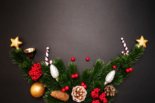 Christmas pine tree with xmas decoration on black background