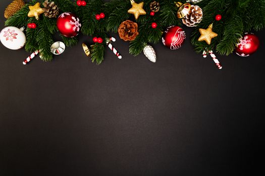 Christmas pine tree with xmas decoration on black background