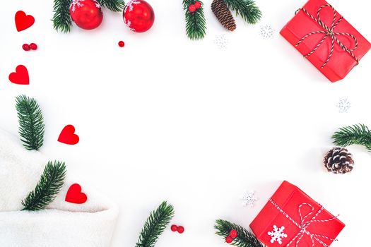 Christmas composition. Christmas gift, fir blanket, pine cones, fir branches on white background. Flat lay, top view, copy space
