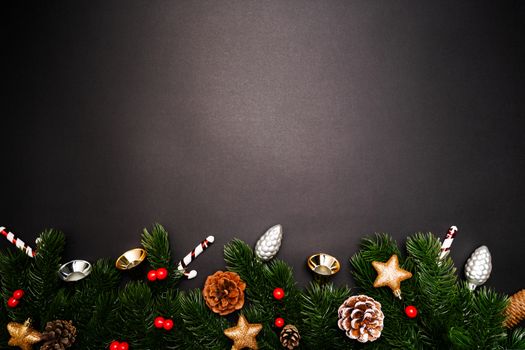 Christmas pine tree with xmas decoration on black background