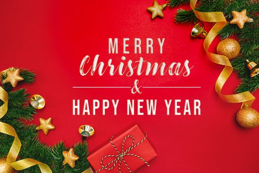 Christmas present and pine tree with xmas decoration on Red background