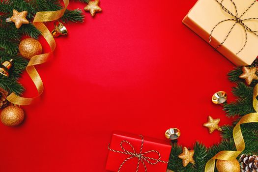 Christmas present and pine tree with xmas decoration on Red background