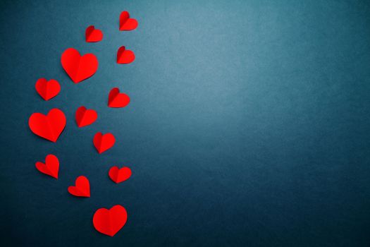 Valentine card with red heart on blue background, abstract, flat lay, top view