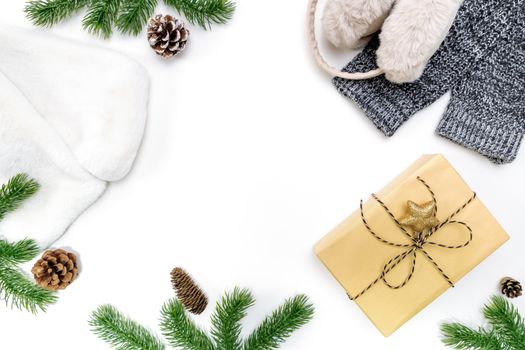 Christmas winter composition. Christmas gifts box with pine cones, fir branches on white background. Flat lay, top view, copy space