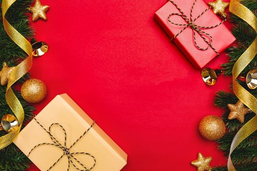 Christmas present and pine tree with xmas decoration on Red background