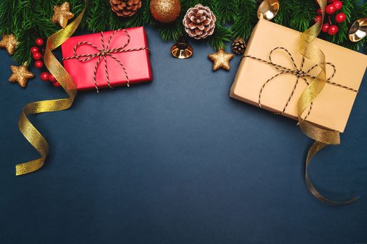 Christmas present and pine tree with xmas decoration on blue background