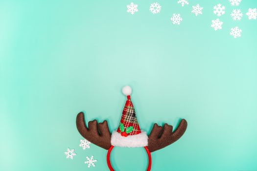 Christmas background concept. Top view of Christmas decoration, Santa Claus and reindeer on green background